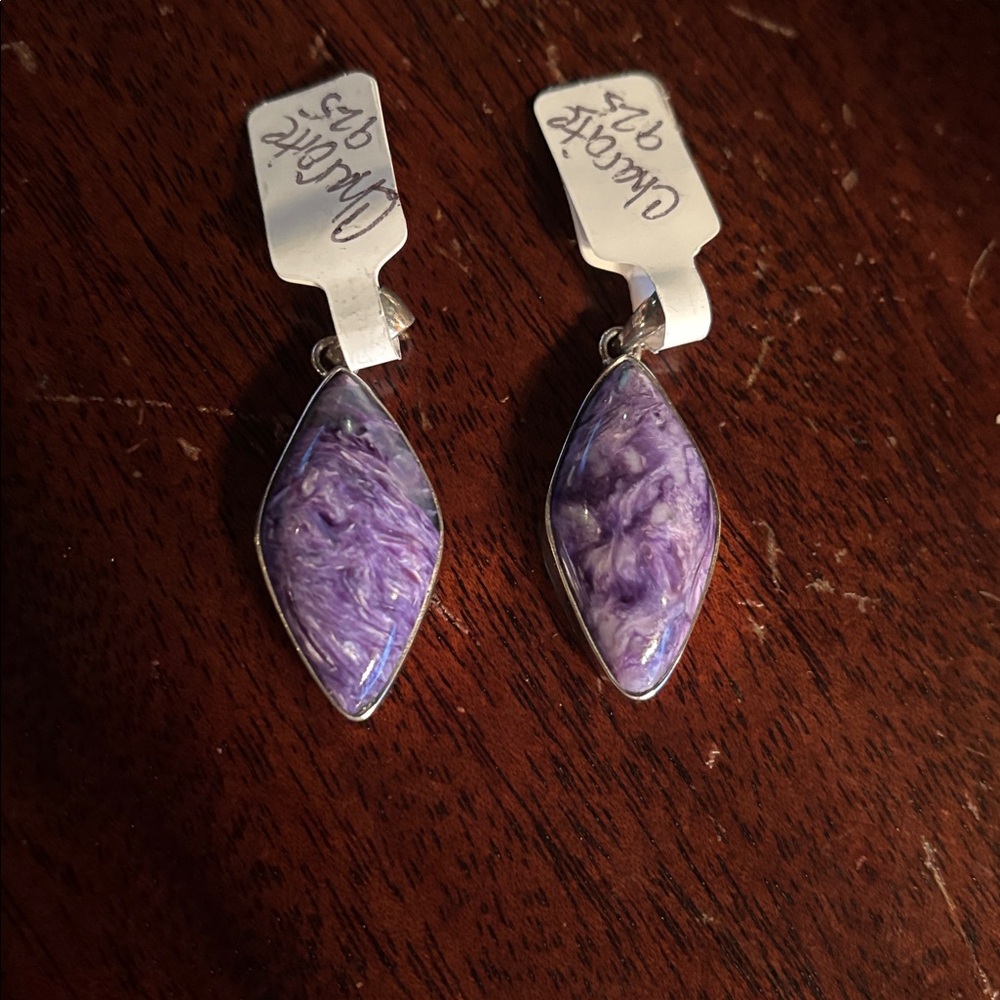 Charoite Pendant in sterling silver setting. Beautiful and rare piece.